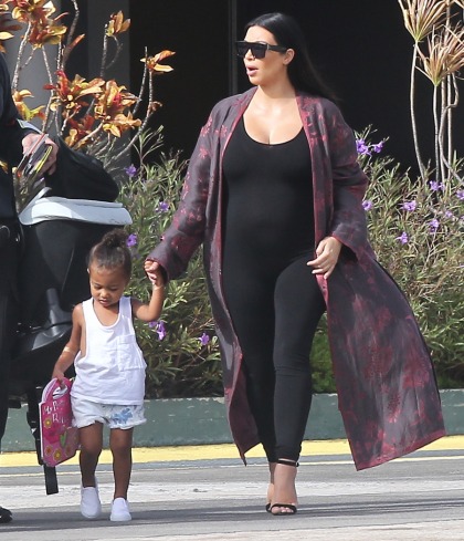 Kim Kardashian wore a maternity onesie for a long plane ride: fine or terrible?