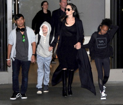 Angelina Jolie's LAX airport style involves boots & a slinky dress: fab or meh'