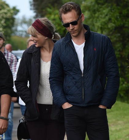 Taylor Swift held hands with Hiddles as they went down the 'Taymerica' slide