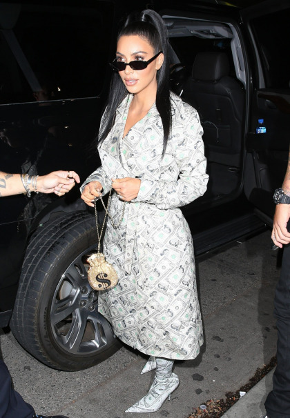 Kim Kardashian wore a coat & a pair of boots covered in dollar bills, because why not