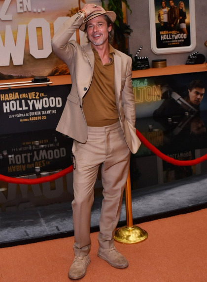 Brad Pitt tries to bring back fedoras, 'lift' shoes and fug brown suits all at once