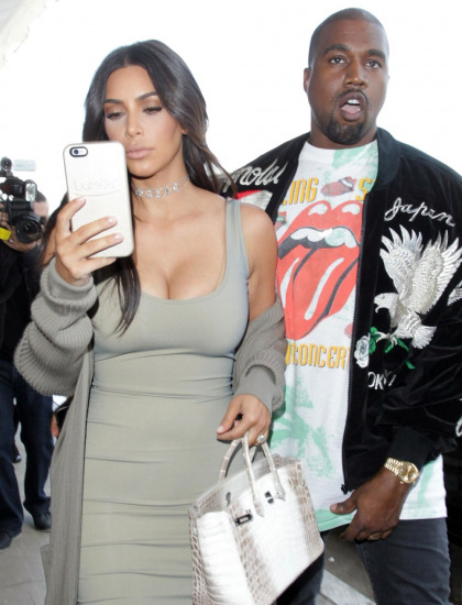 Kim Kardashian 'wants to be there' for Kanye, she's 'holding onto her marriage'