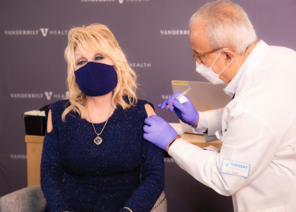 Dolly Parton helped popularize shoulder cut outs or 'vaccine shirts' again