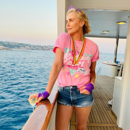 Charlize Theron had an 80s prom murder mystery cruise party for her 46th b-day