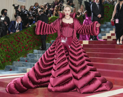 Gigi Hadid went futuristic with Versace vinyl & a huge puffer coat at the Met Gala